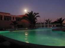 Club Resort pool under full moon